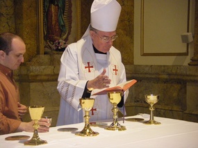 GT Walsh consecrating chalices3 May 14 2010.jpg
